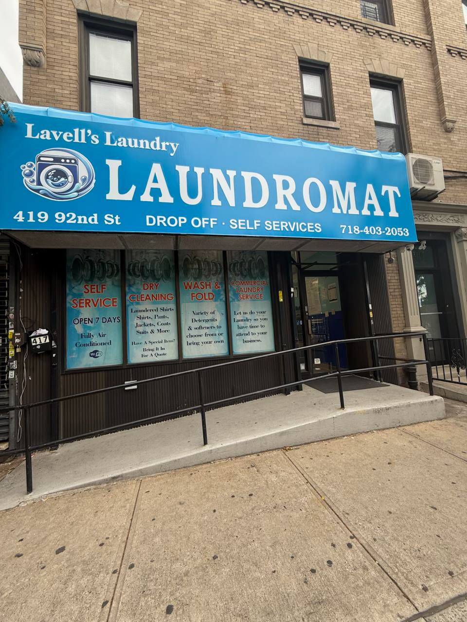Lavell's Laundry storefront with blue awning at 419 92nd Street, Brooklyn